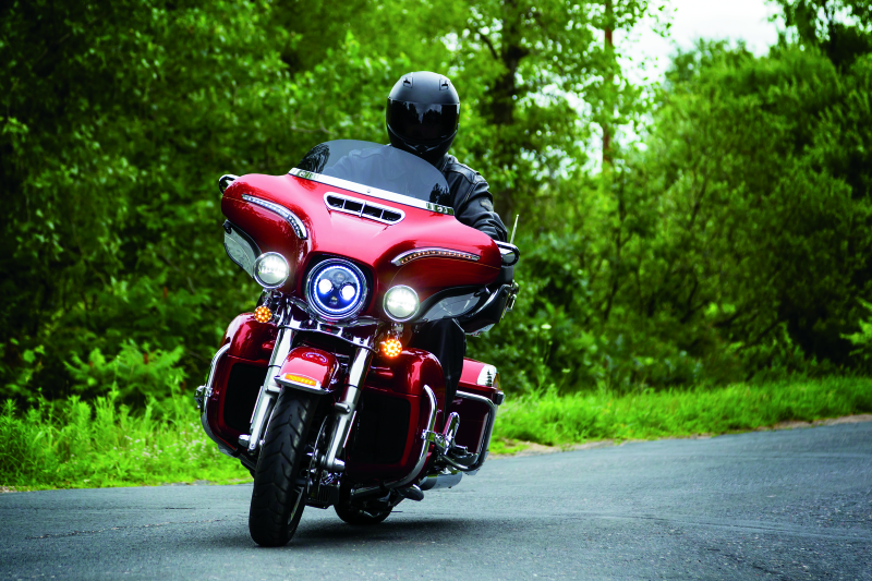 Kuryakyn Chrome Smooth Windshield Trim for Harley-Davidson Touring motorcycles, showing sleek, polished chrome design on a motorcycle windshield