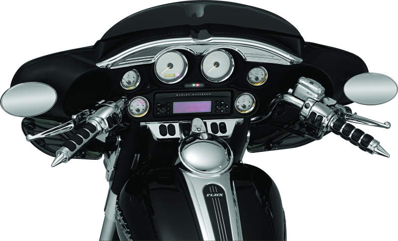 Chrome Kuryakyn switch panel accent for Harley Davidson Touring models, part 3783, shown installed on motorcycle dashboard.