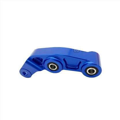 Blue CNC aluminum suspension linkage for Surron LBX electric bike by eDirtyBike, showcasing precise machining and lightweight design.