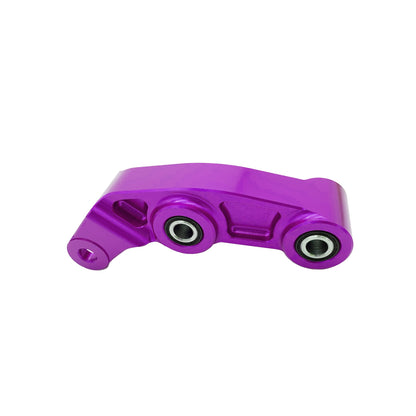 Purple CNC aluminum suspension linkage for Surron LBX electric bike by eDirtyBike, showcasing precise machining and vibrant color.