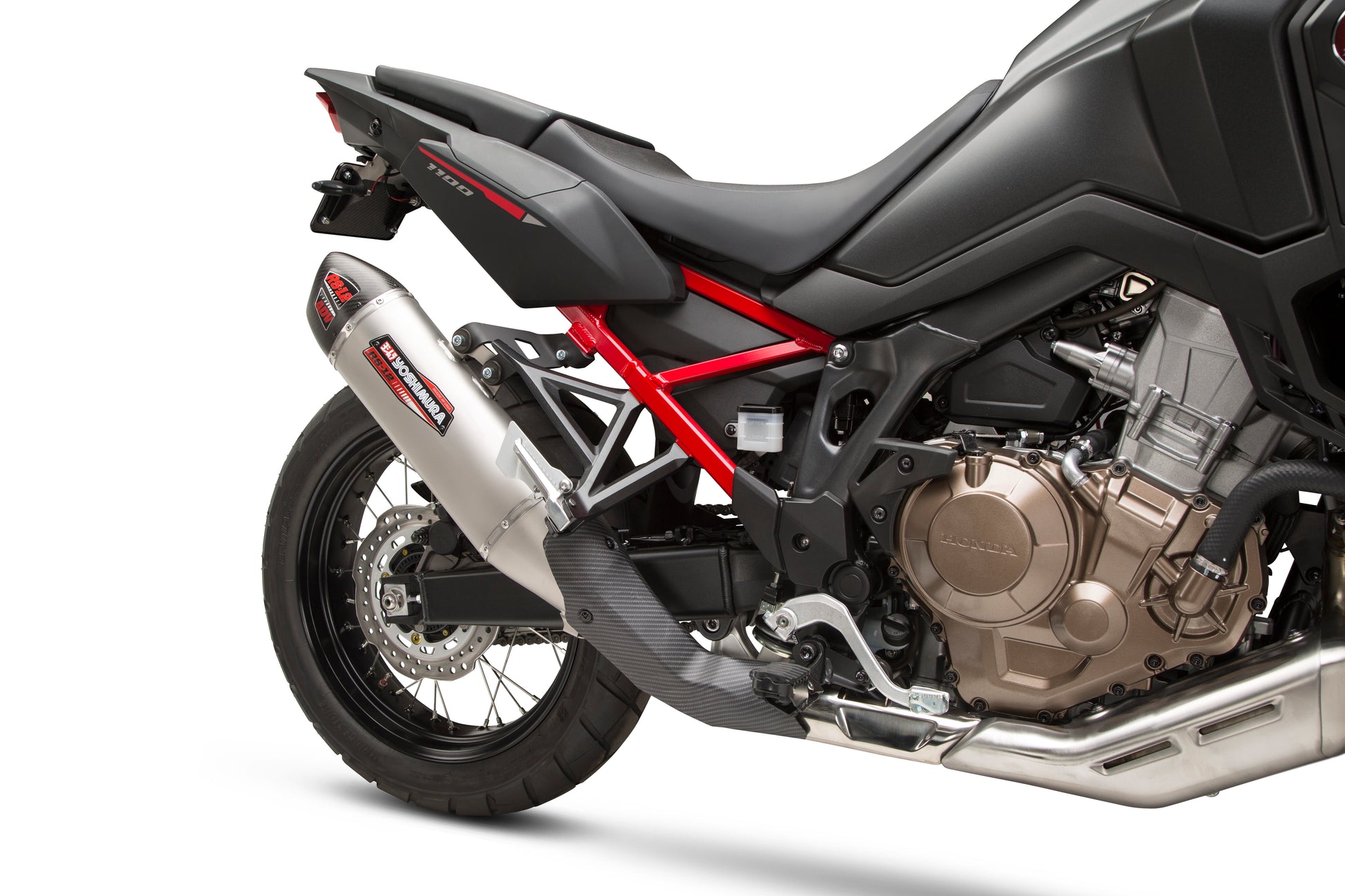 YOSHIMURA RS-12 slip-on exhaust for off-road vehicles, showing the stainless steel muffler with branding and mounting details.
