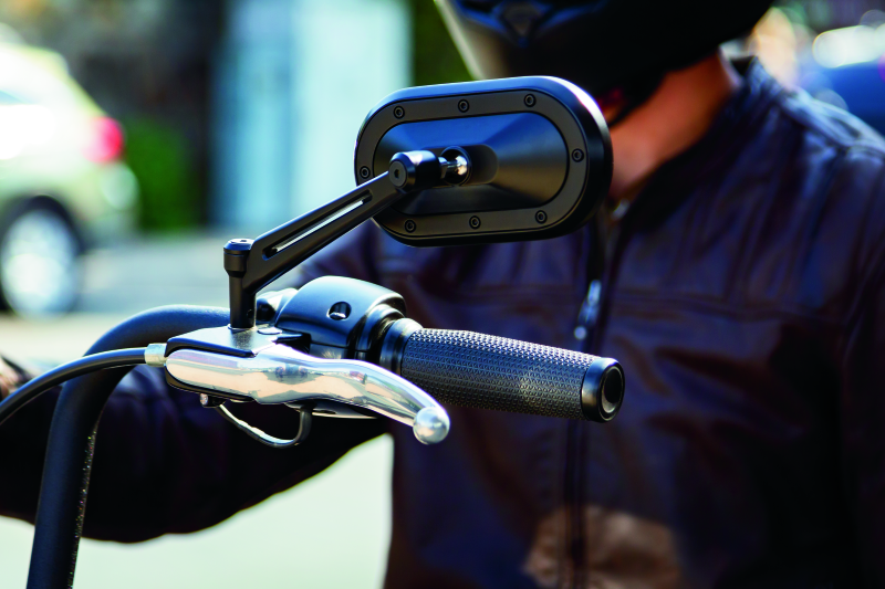Kuryakyn Thresher Grips for throttle-by-wire motorcycles, black ergonomic powersports hand grips with shark tooth knurling pattern.