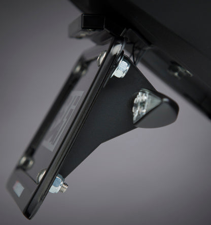 YOSHIMURA universal motorcycle turn signal bracket attached to a bike, showcasing durable metal construction and mounting points