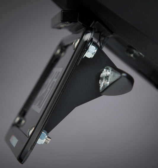 YOSHIMURA universal motorcycle turn signal bracket attached to a bike, showcasing durable metal construction and mounting points