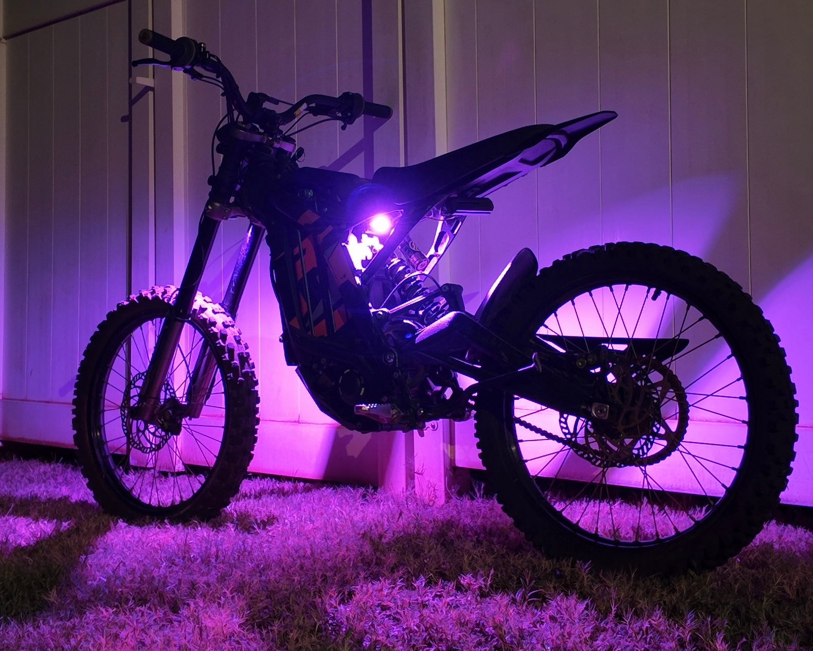 Project9 HyperGlow Underglow Kit for E Ride Pro 3.0 & SR, showing front and rear LED underglow lights installed on a vehicle.