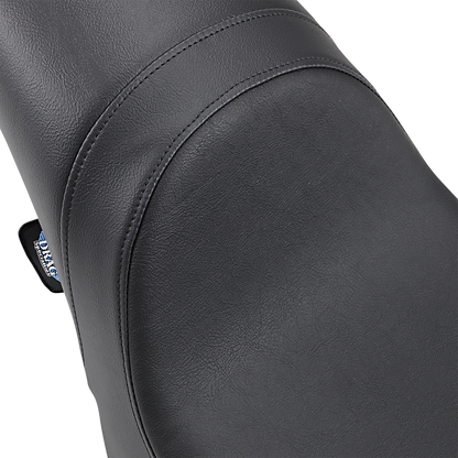 Drag Specialties Predator Seat for Harley FLST/FXST 1984-1999, smooth black motorcycle seat with durable, comfortable design.
