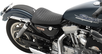 Drag Specialties solo seat for Harley-Davidson XL '82-'03, classic style, black leather, and contoured design for comfortable riding.