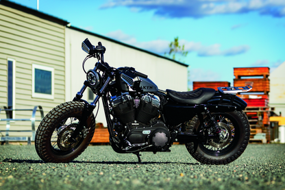 Kuryakyn satin black front axle nut caps for Harley Davidson touring motorcycle front wheels