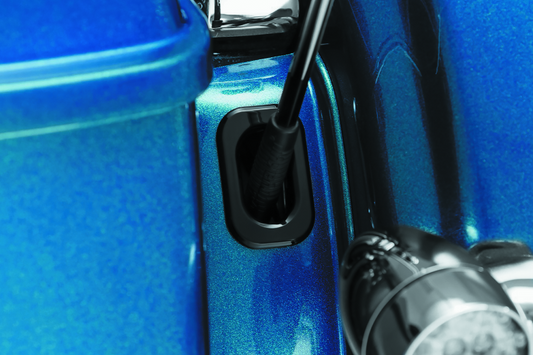 Kuryakyn antenna hole accent for Harley Davidson Street Glide and Road Glide motorcycles, featuring chrome finish and stylish design.