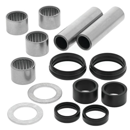 QuadBoss Yamaha YFZ450 swingarm repair kit with metal components and replacement parts for motorcycle suspension maintenance.
