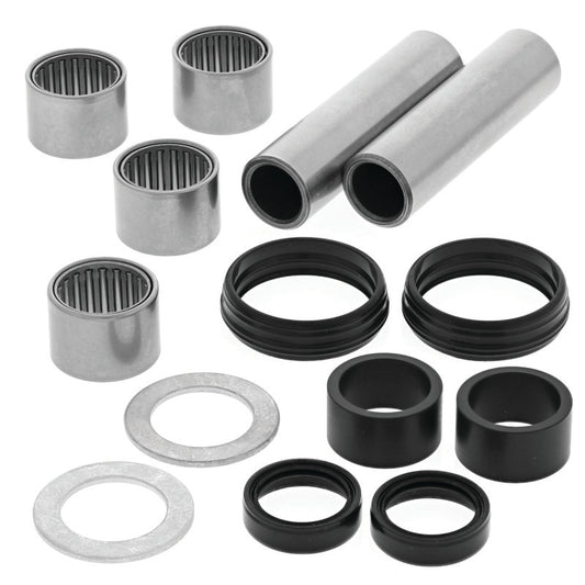 QuadBoss Yamaha YFZ450 swingarm repair kit with metal components and replacement parts for motorcycle suspension maintenance.