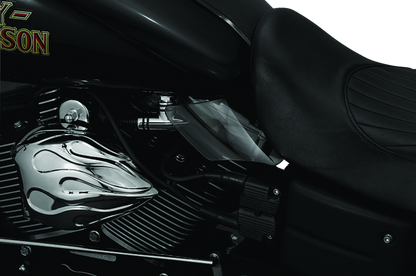 Kuryakyn Saddle Shields heat deflectors installed on a Dyna motorcycle, providing rider protection from heat on the seat area.