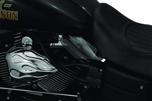 Kuryakyn Saddle Shields heat deflectors installed on a Dyna motorcycle, providing rider protection from heat on the seat area.