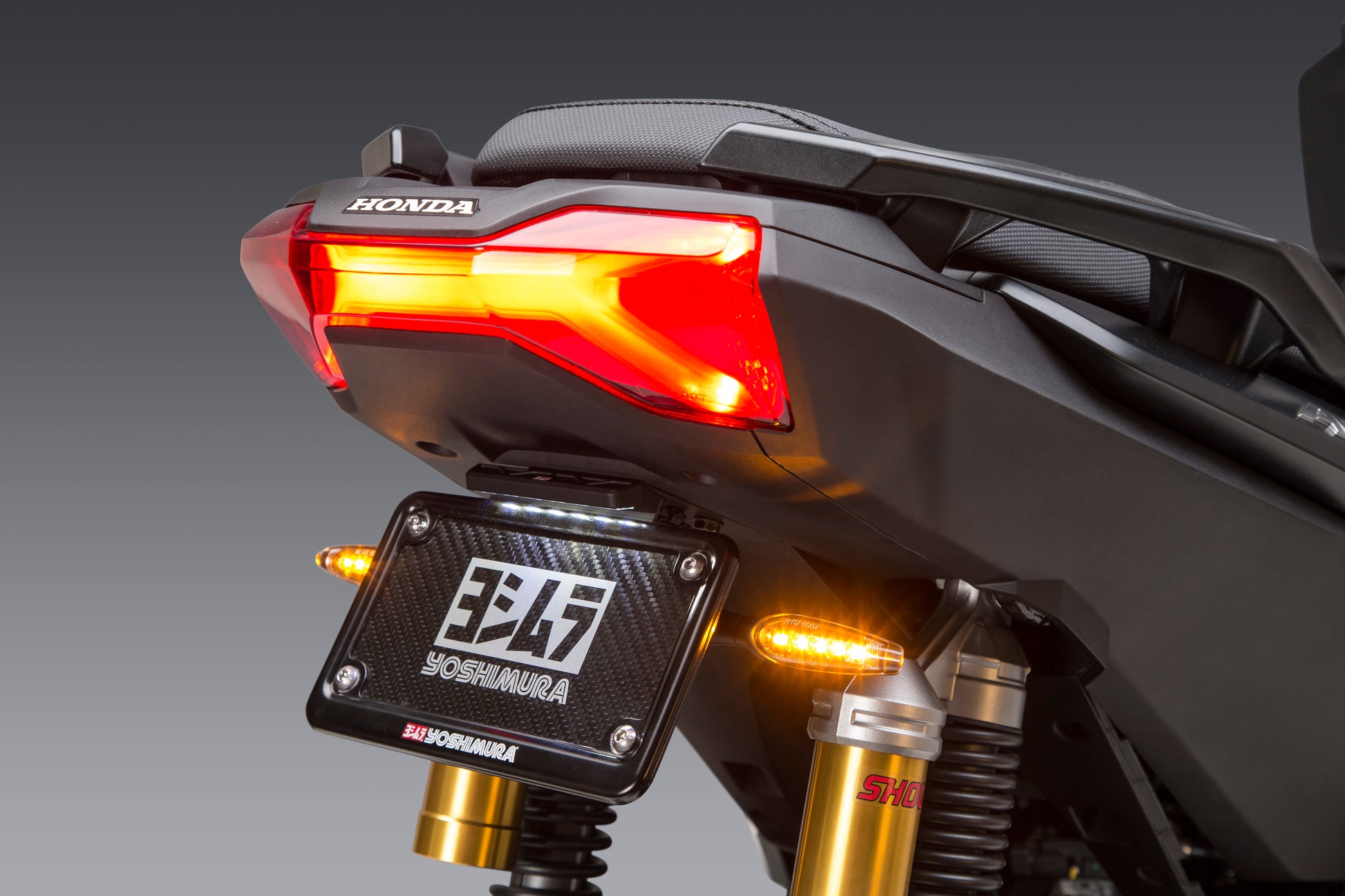 YOSHIMURA Fender Eliminator Kit for Honda motorcycles, showing sleek black license plate holder and compact design.