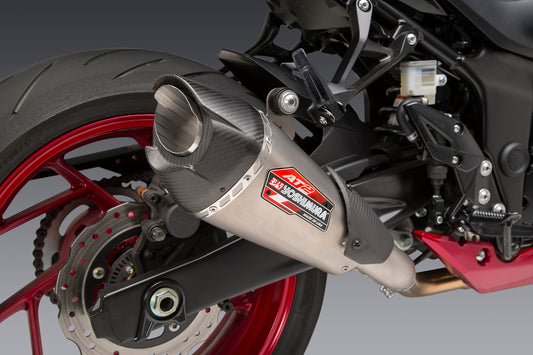 YOSHIMURA Street AT2 slip-on exhaust with carbon fiber end cap and works finish for motorcycle, shown on a bike.