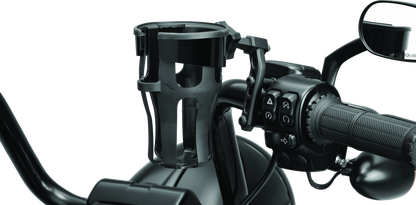 Kuryakyn Reflex drink holder perch mount in black attached to a powersports vehicle handlebar for convenient hydration.