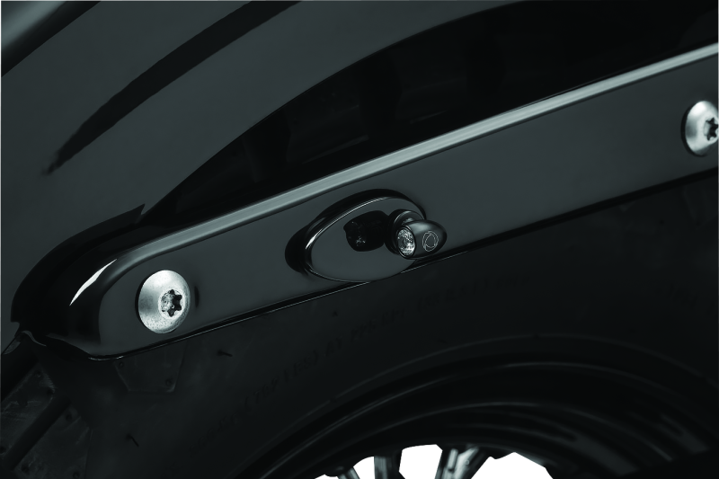 Kuryakyn Fender Strut Cover Plates for Harley-Davidson motorcycles, designed to enhance the rear fender appearance.