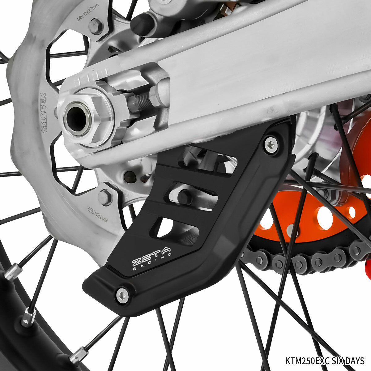 ZETA rear disc guard for ZE52-5100, aluminum impact protection with polyurethane bumper, mounted on motorcycle wheel.