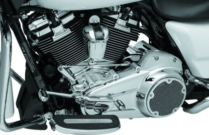 Kuryakyn chrome inner primary cover for Harley Davidson Touring models, showcasing polished finish and detailed design.