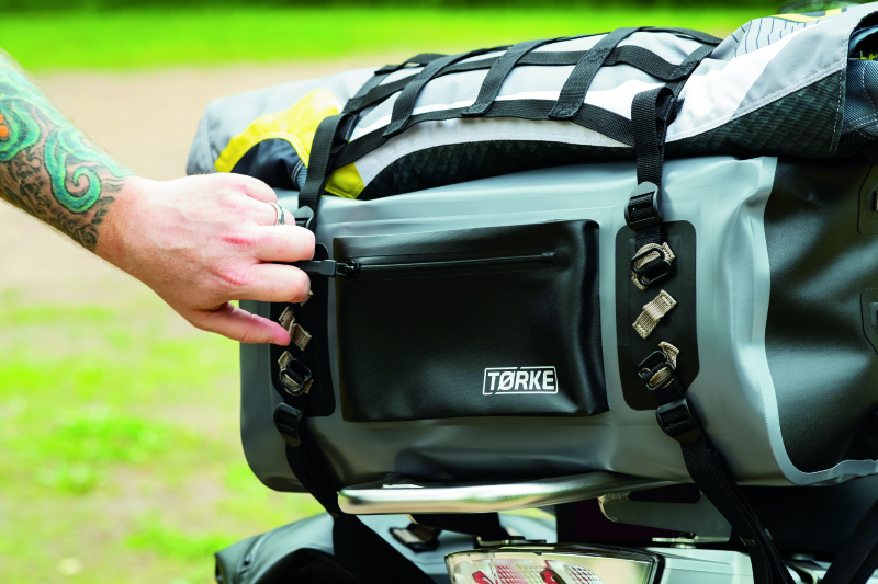 Kuryakyn Torke 35L Dry Duffle Bag for powersports, waterproof gear storage with black durable fabric and adjustable straps.