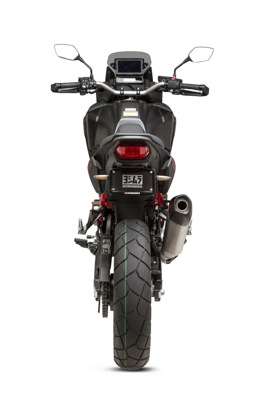 YOSHIMURA RS-12 slip-on exhaust for off-road vehicles, showing the sleek metal muffler and mounting hardware.