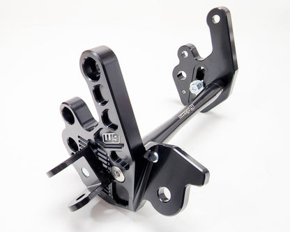 Warp9Racing Sur-ron LBX and 79Bike adjustable foot peg mount with sturdy metal construction and mounting hardware.