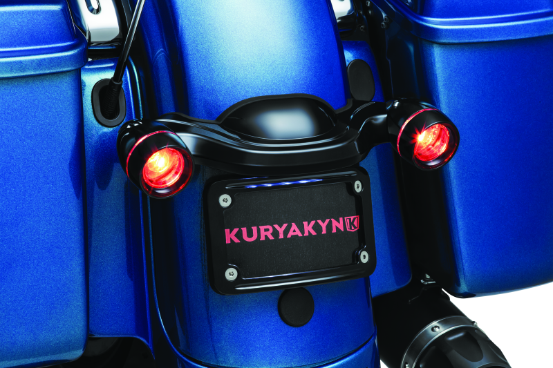 Kuryakyn curved license plate mount for Harley-Davidson Street Glide and Road Glide, part #3147, shown on motorcycle rear.