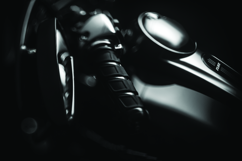 Kuryakyn Kinetic Grips in black for powersports vehicles, featuring textured design and ergonomic shape.