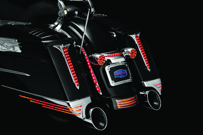 Kuryakyn LED turn signal bar filler panel for Harley Davidson FLHX and FLTRX models, showing sleek black design with integrated LEDs.