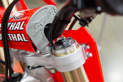 Motion Pro Compression Adjuster for Showa 49mm forks, motorcycle suspension part, shown in close-up with black and silver components.