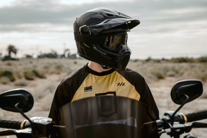 Black ICON Airflite™ Peak helmet part from Bill's Exhausts, showing the sleek, aerodynamic helmet visor and peak attachment.
