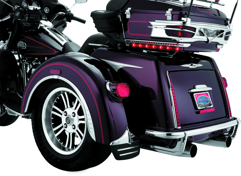 Kuryakyn rear bumper accents for Harley-Davidson trikes, part number 7223, showcasing chrome trim on the trike's rear bumper area.