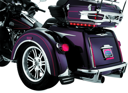 Kuryakyn rear bumper accents for Harley-Davidson trikes, part number 7223, showcasing chrome trim on the trike's rear bumper area.