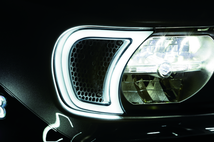 Kuryakyn Tracer Headlight Vent Accents for Harley-Davidson Road Glide, shown on motorcycle front with chrome finish.