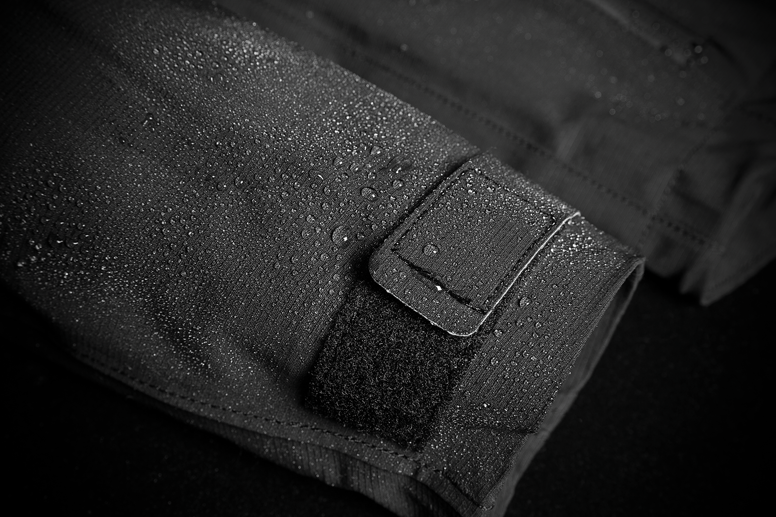 Black ICON Stormhawk Jacket CE in XL size, featuring durable material and protective design, displayed on a hanger.
