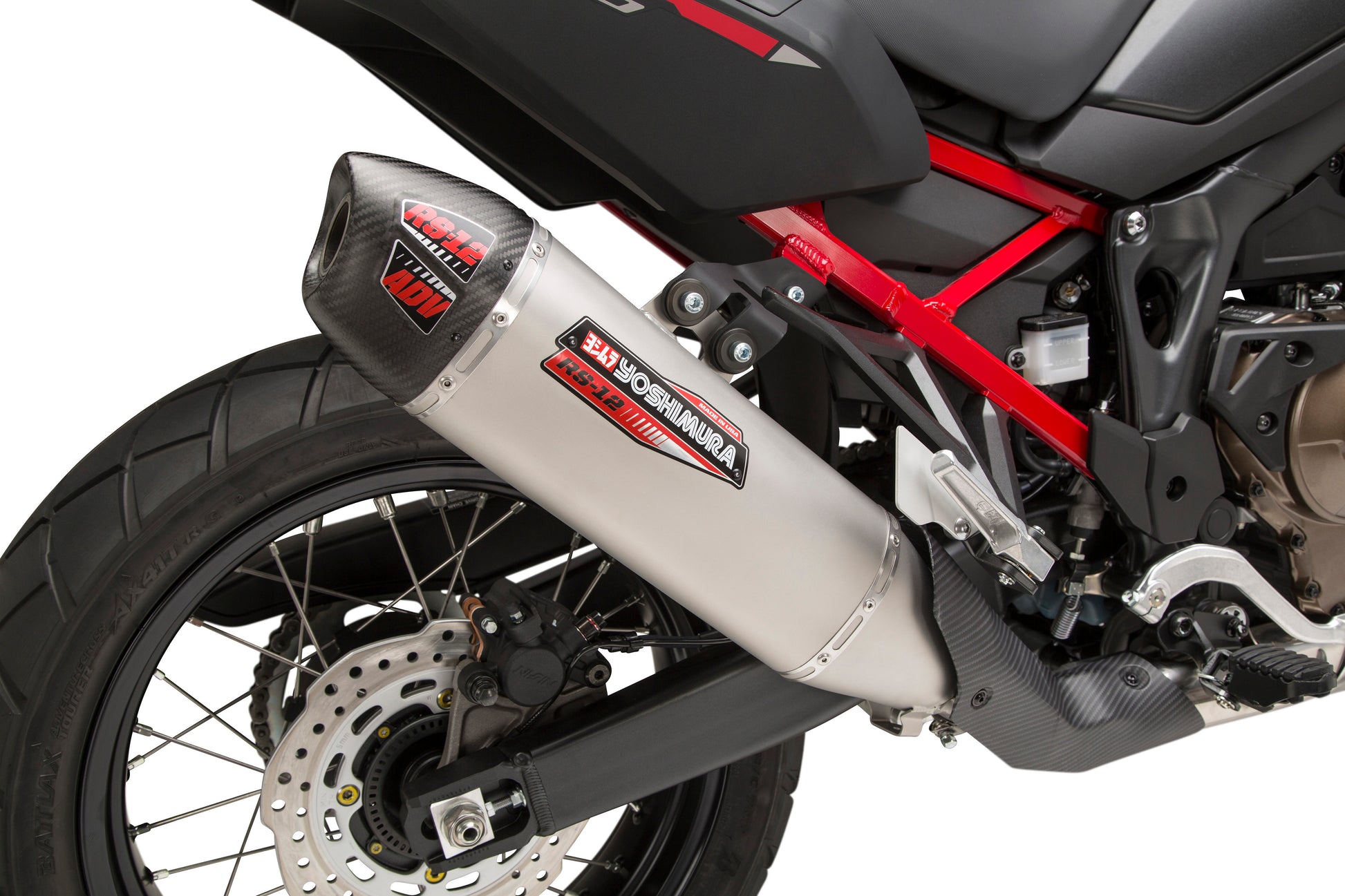 YOSHIMURA RS-12 slip-on exhaust for off-road vehicles, showcasing the sleek, metallic design and branding on the exhaust pipe.