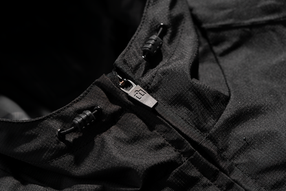 Black ICON PDX3™ jacket in XL size, featuring a sleek design and visible zipper details, by Bill's Exhausts.
