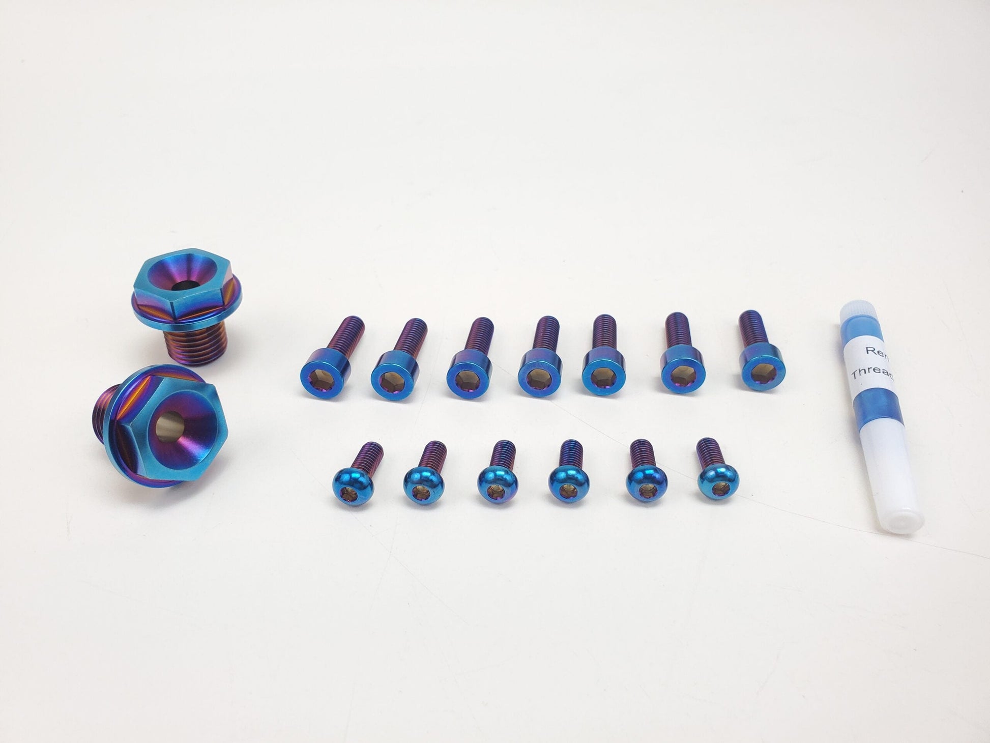 Titanium fork bolts kit for Surron and Talaria bikes, by Warp9Racing, featuring durable fasteners for motorcycle suspension.