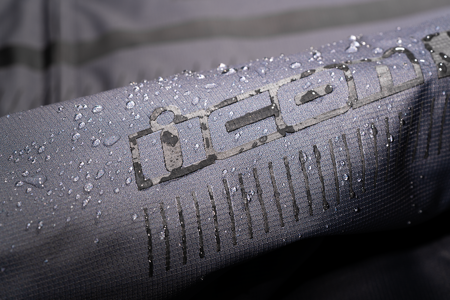 Gray ICON PDX3™ jacket in large size, featuring a sleek design with visible zipper and adjustable collar, by Bill's Exhausts.