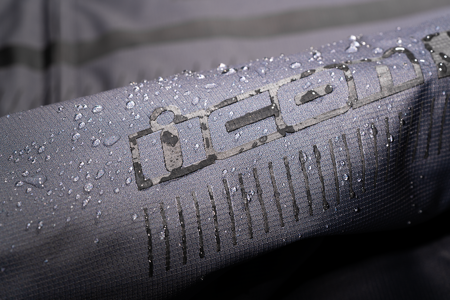 Gray ICON PDX3™ jacket in XL size, featuring a sleek design with visible branding and a front zipper pocket.