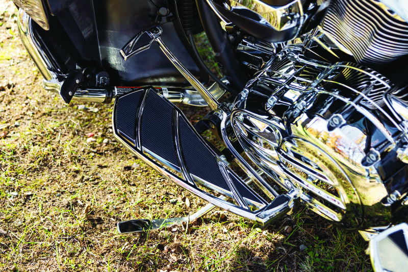 Kuryakyn Phantom shift and brake pegs in chrome for Indian Scout motorcycle, featuring sleek, durable design and mounting hardware.