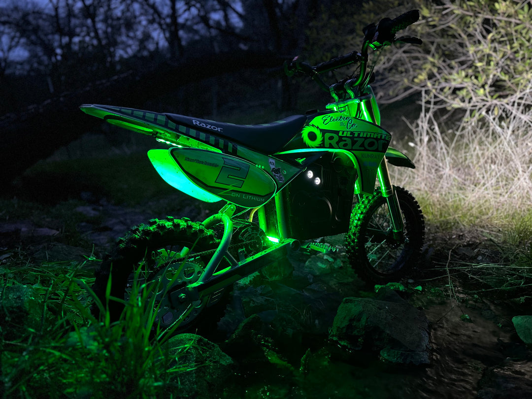 Electro & Co UltraVision Pro LED headlight kit mounted on a dirt bike handlebar showing low-profile design for 7/8" and 1" handlebars.