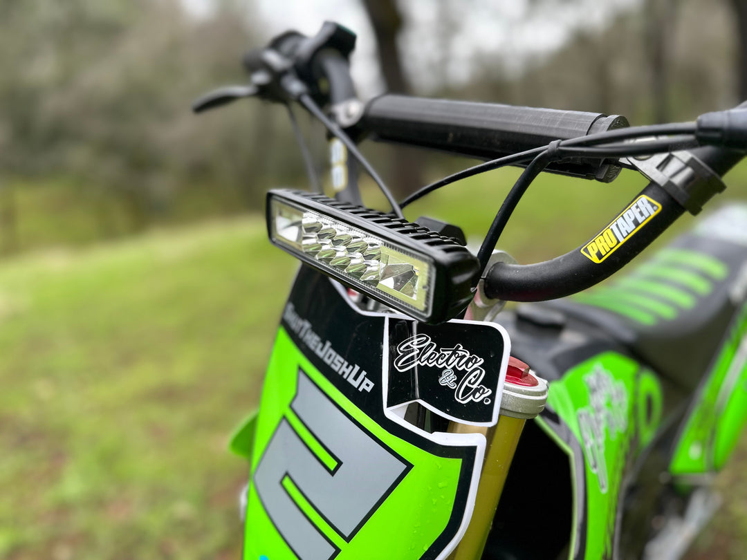 Electro & Co UltraVision Pro LED headlight kit for dirt bikes, low-profile 12V electric headlight on handlebars, compact and bright.