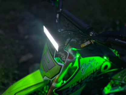 Electro & Co UltraVision Pro LED dirt bike headlight kit mounted on handlebar, compact low-profile design for 7/8" and 1" handlebars.