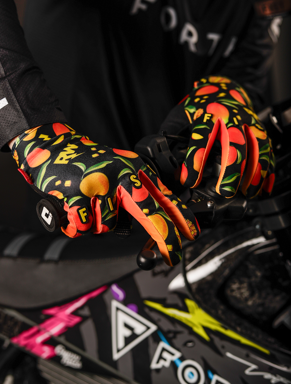 FIST Handwear Mango Madness R-Willy gloves in red label with straps, 2XS size, featuring bright red color and textured design.