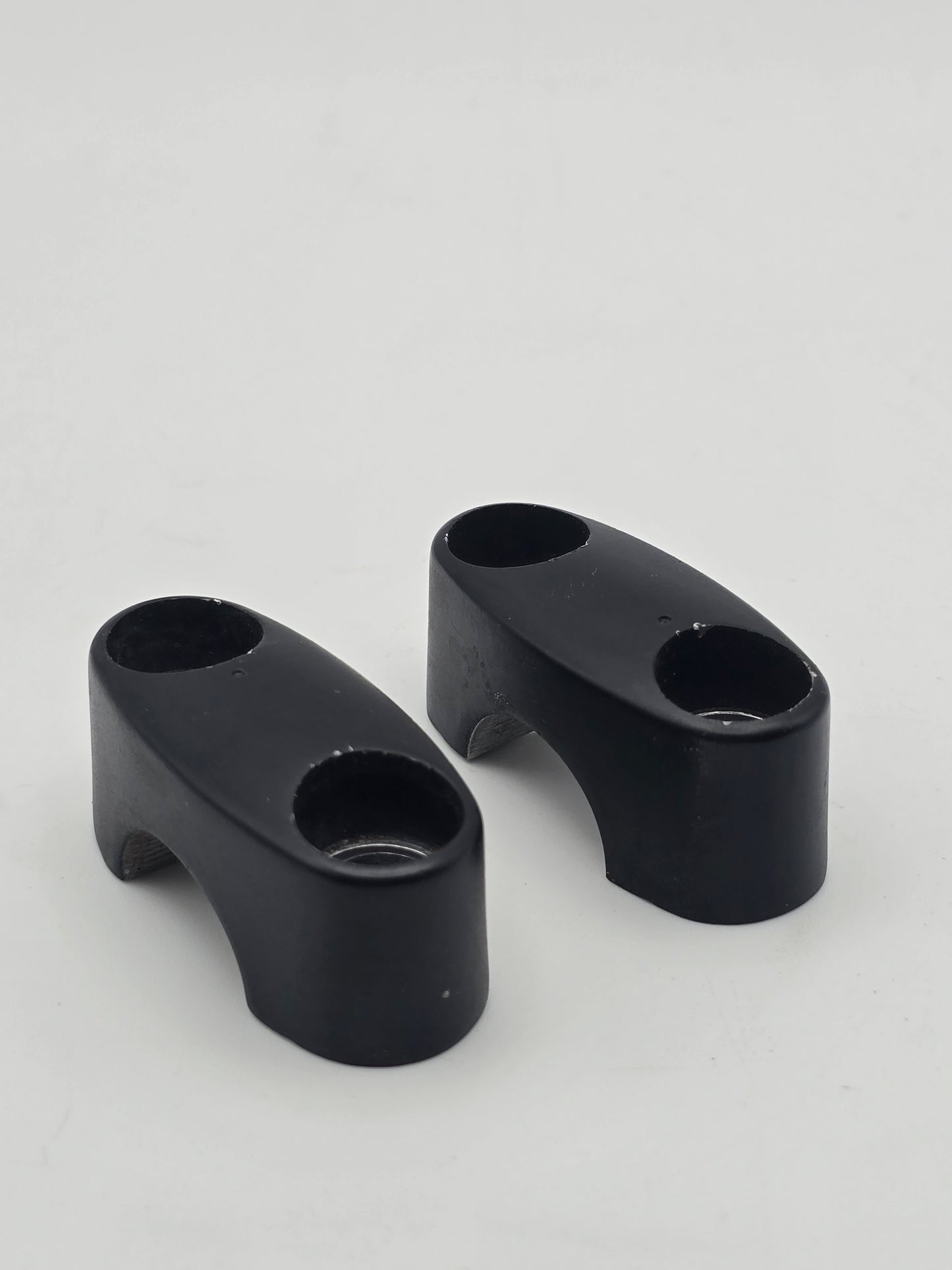 Used Honda Grom OEM handlebar mounts, pair of handlebar holders for models 2014-2020, durable motorcycle handlebar mounts.