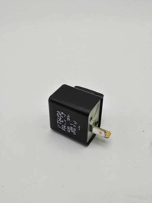 Used Honda Grom OEM turn signal relay, motorcycle signal relay part for Honda Grom with electrical connectors visible.