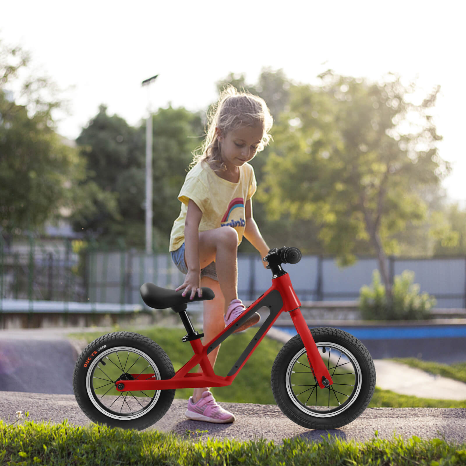 Black Hycline ChopShip 12-inch baby balancing bike with training wheels, designed for young children to develop riding skills.