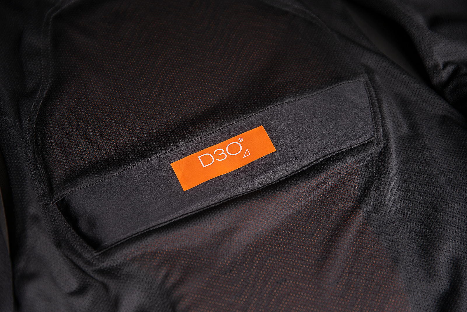 ICON Backlot vest in black with relaxed fit and Ax® Laredo synthetic chassis, size L/XL, displayed on a hanger.
