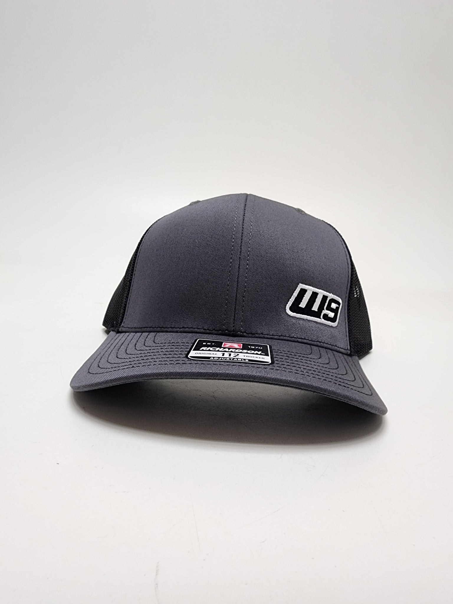 Warp9Racing W9 Small Logo Hat, stylish black apparel cap with embroidered Warp9Racing logo on front, adjustable strap.